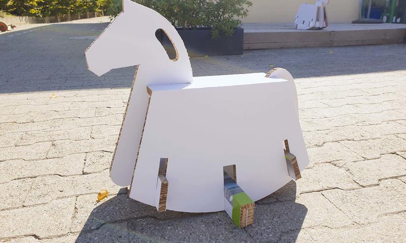 Rocking horses made from exhibition walls